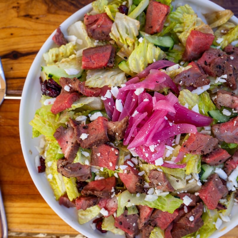Brody's Restaurant's BBQ steak salad with lettuce, feta, and pickled red onions.